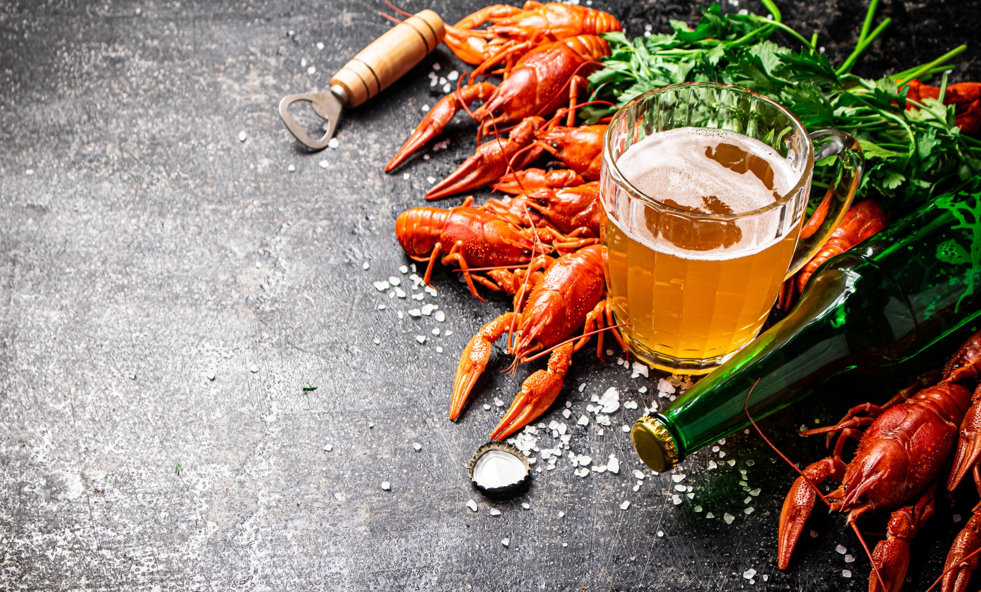 Boiled crayfish with a glass of beer.